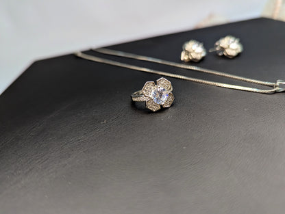 Elegant Silver-Tone Flower Jewelry Set with Sparkling Crystals (Necklace, Earrings & Ring)  Product Description: